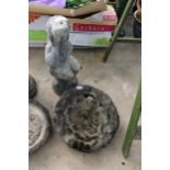 A CONCRETE GARDEN BIRDBATH WITH CHERUB PEDESTAL BASE