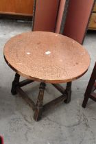 A COPPER TOP COFFEE TABLE 23.5" DIAMETER