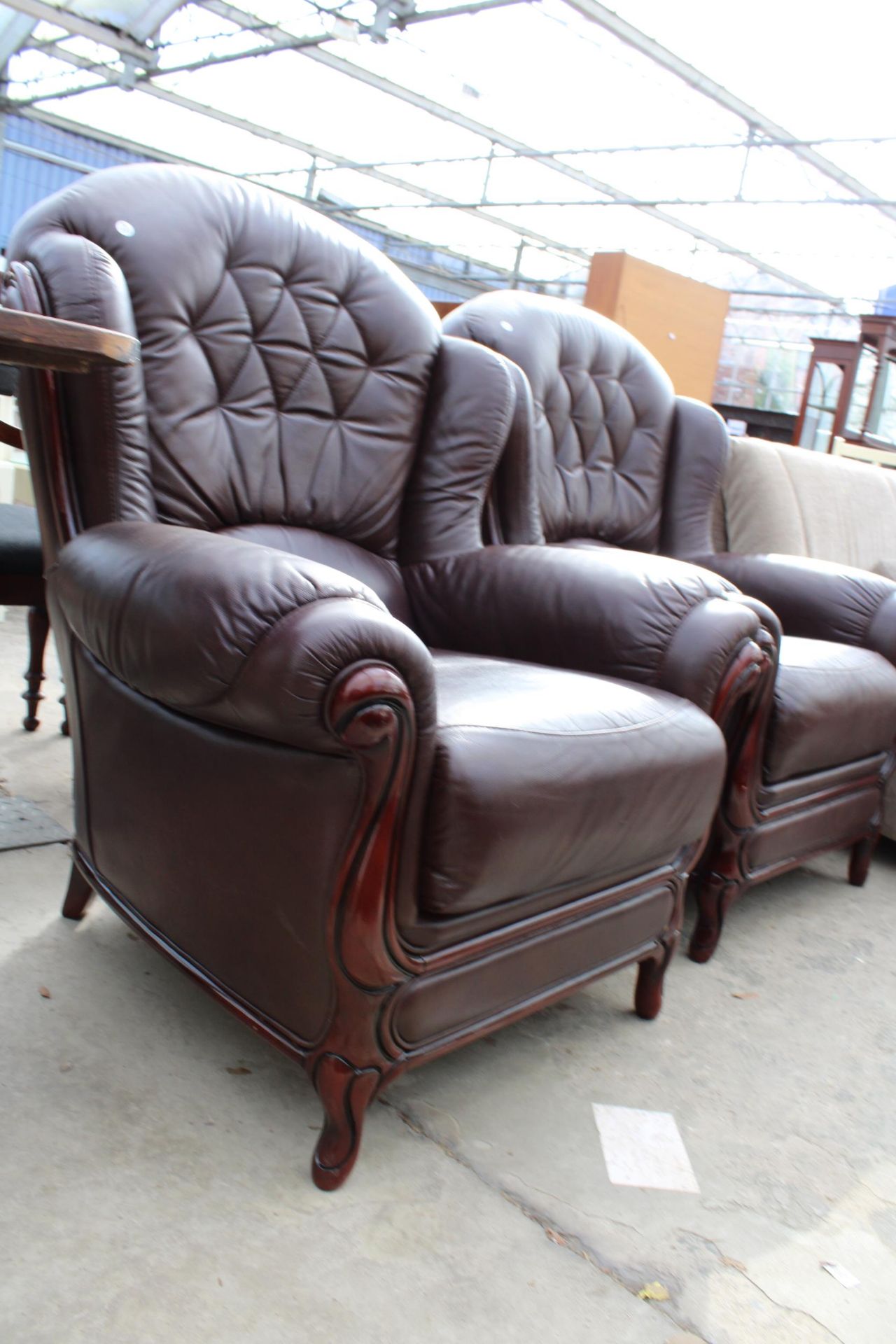 A PAIR OF RED LEATHER EASY CHAIRS WITH PARTIAL WING BACKS - Image 2 of 2