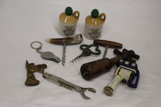 A TIN OF COLLECTABLES TO INCLUDE VINTAGE BOTTLE OPENERS, TWO MINIATURE SCRUMPY BOTTLES FROM