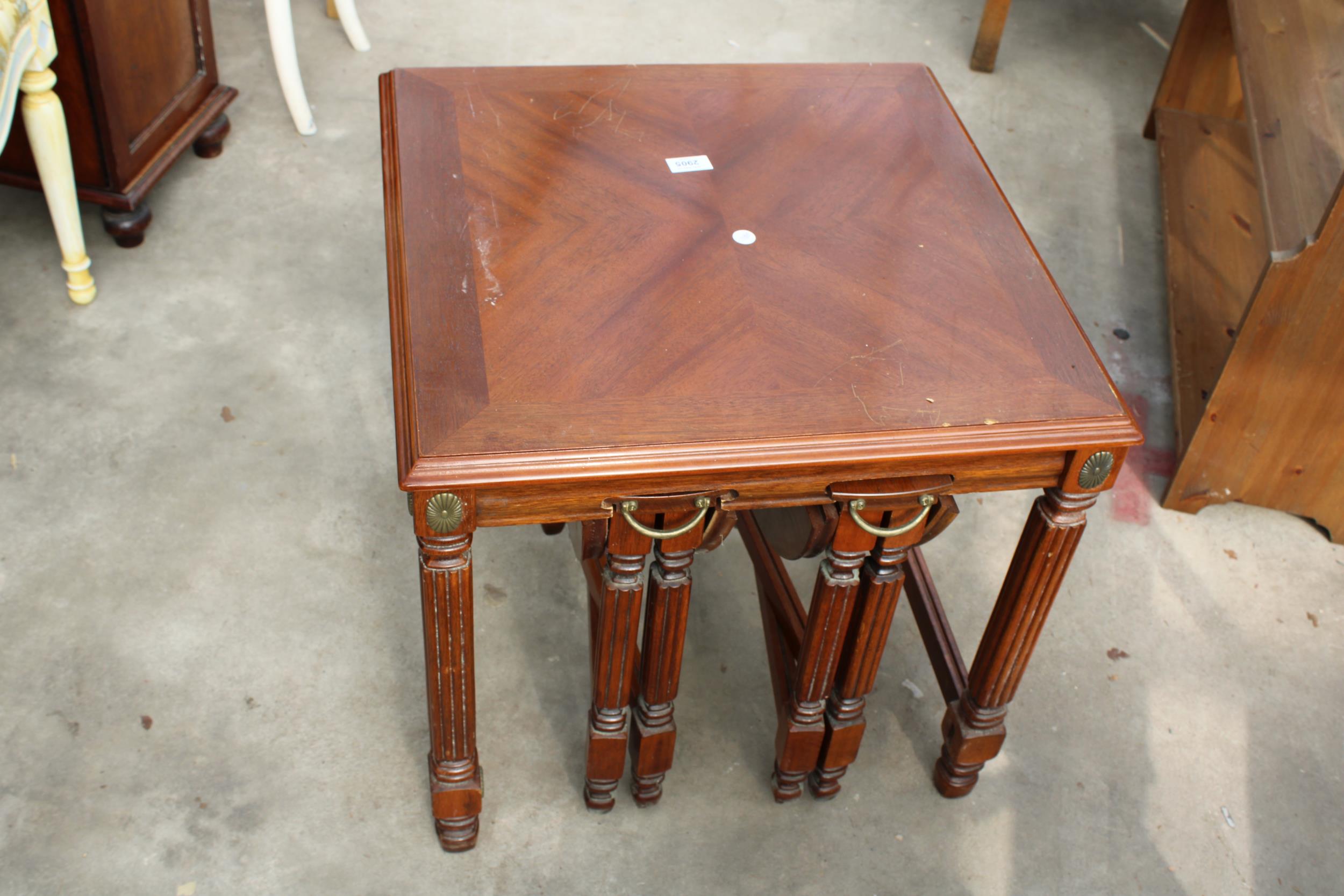 A HARDWOOD NEST OF THREE TABLES , TWO BEING DROP LEAF 17" DIAMETER