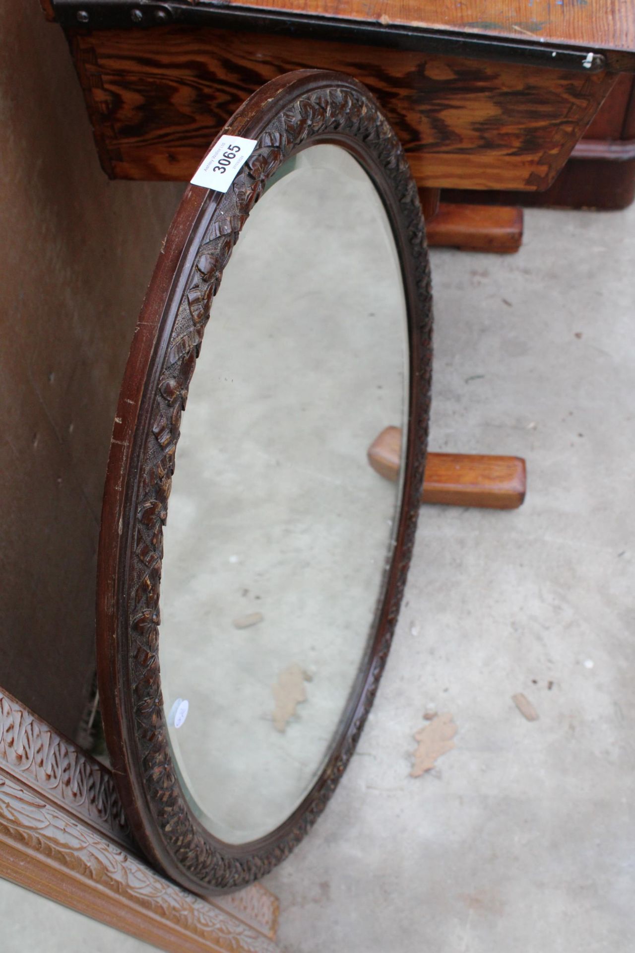 AN EDWARDIAN OVAL BEVEL EDGE MIRROR 33" X 22" - Image 2 of 2