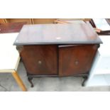 A MAHOGANY CABINET, WITH A QUANTITY OF DVDs AND VIDEOS, AND A PAIR OF MAHOGANY DINING CHAIRS