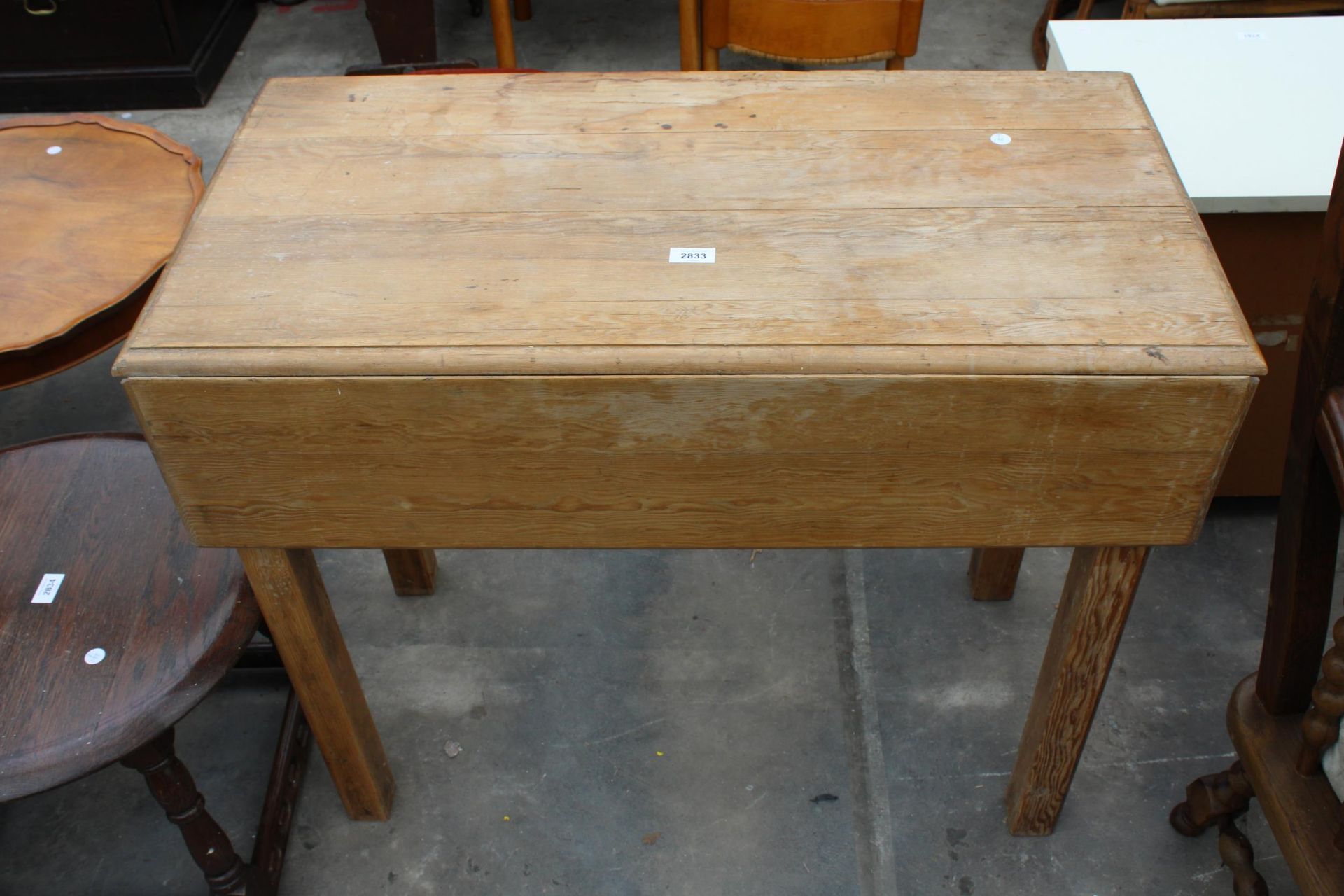 A VICTORIAN PINE AND BEECH DROP LEAF KITCHEN TABLE WITH SINGLE DRAWER