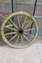 A VINTAGE WOODEN AND METAL BANDED CART WHEEL (D:120CM)