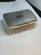 A MARKED STERLING SILVER BRUSH