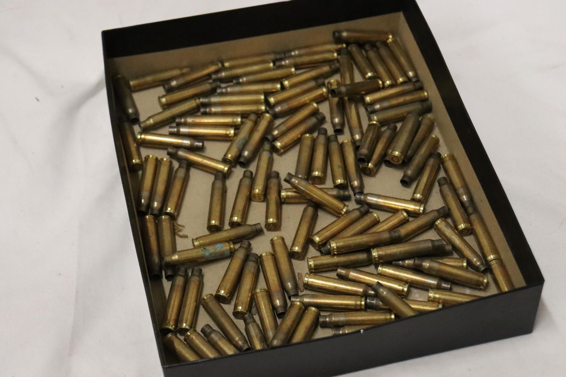 A QUANTITY OF OVER 100 BRASS BULLET CASINGS