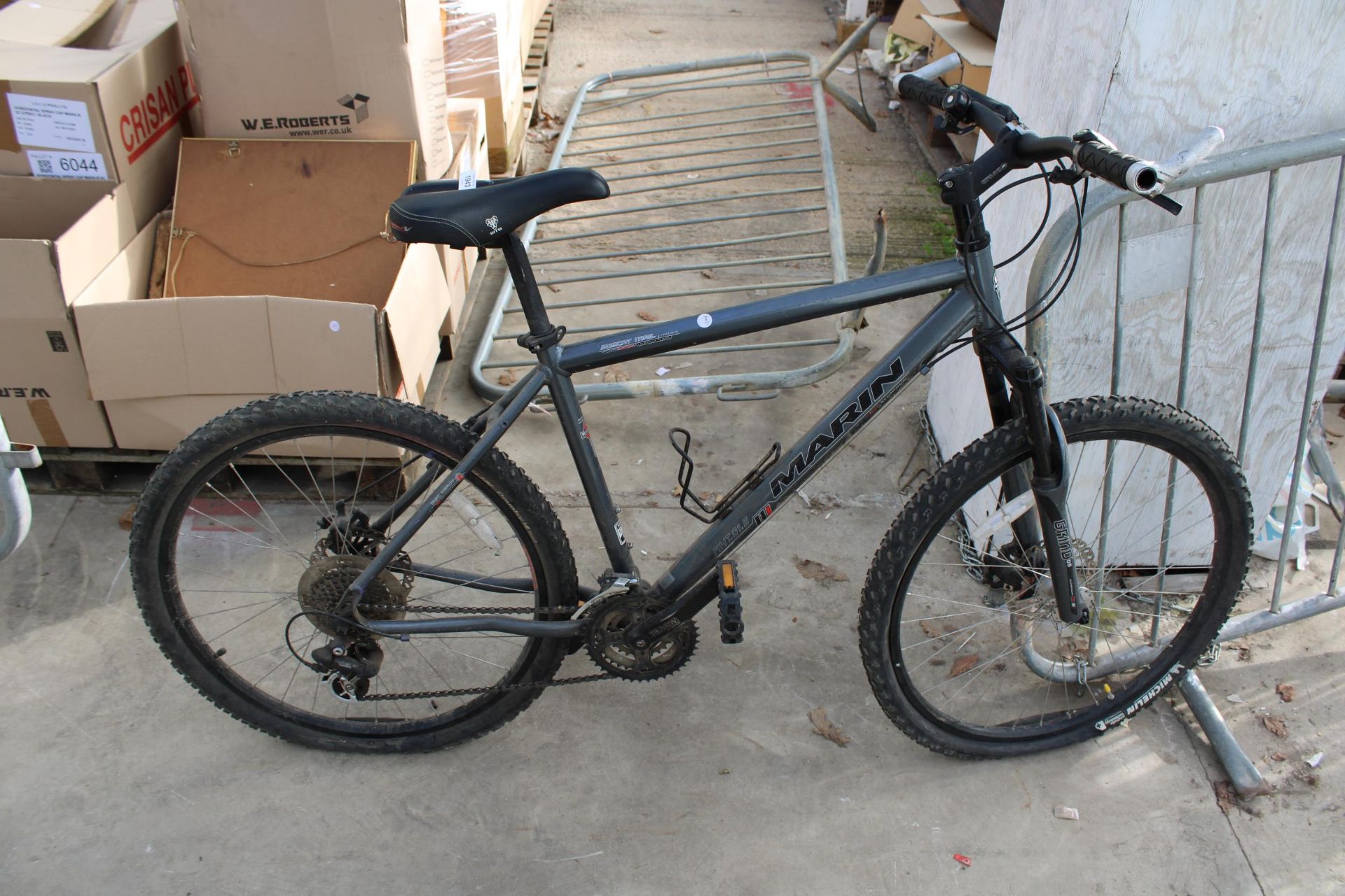 A MARIN BOBCAT TRAIL MOUNTAIN BIKE WITH FRONT SUSPENSION AND 24 SPEED SHIMANO GEARS SYSTEM