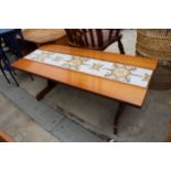 A RETRO TEAK COFFEE TABLE WITH INSET TILE TOP ON WHALE FIN LEGS, 48.5" X 20.5"