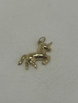 A 9CT YELLOW GOLD UNICORN CHARM