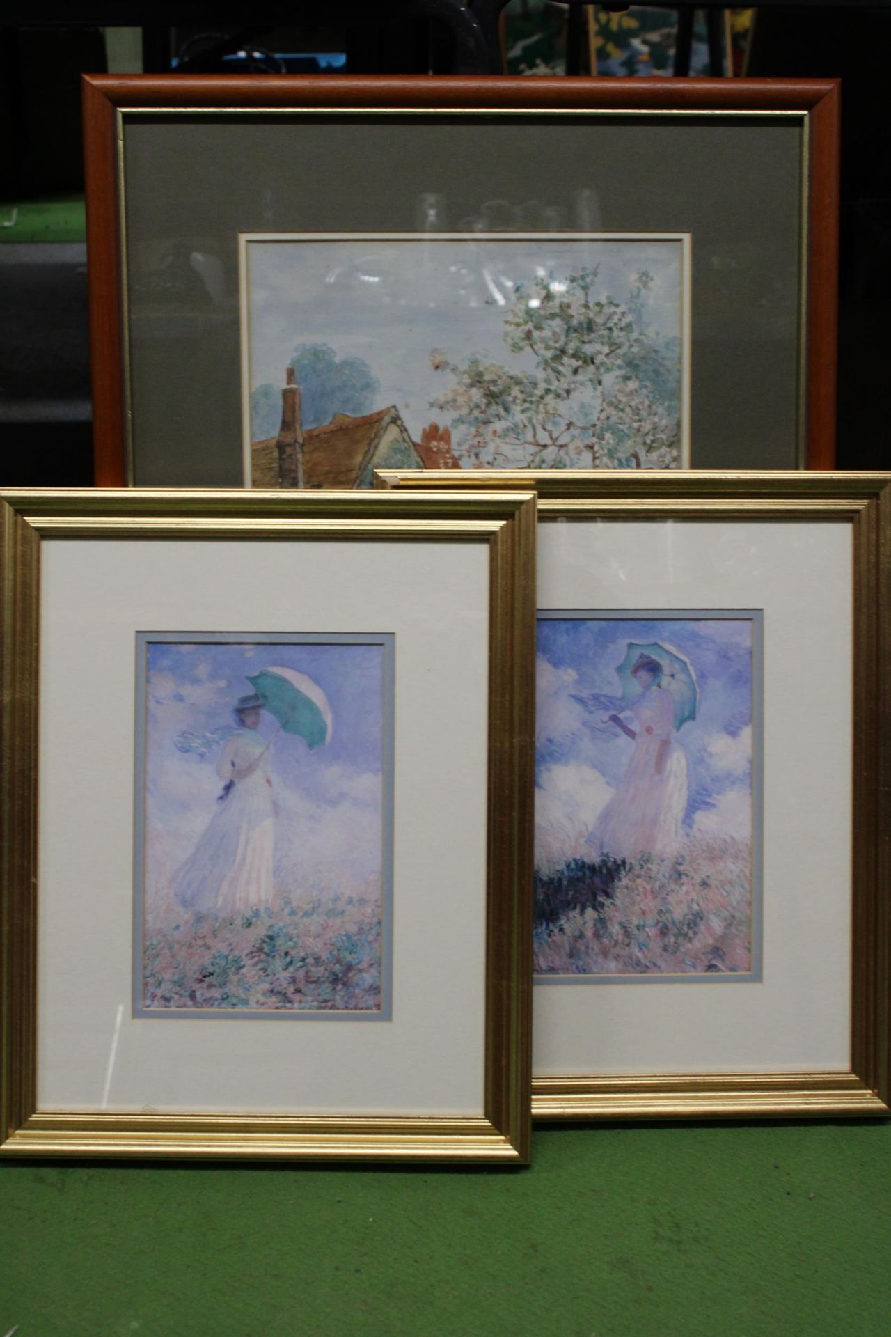 THREE FRAMED PRINTS TO INCLUDE TWO OF LADIES AND ONE OF A RURAL COTTAGE