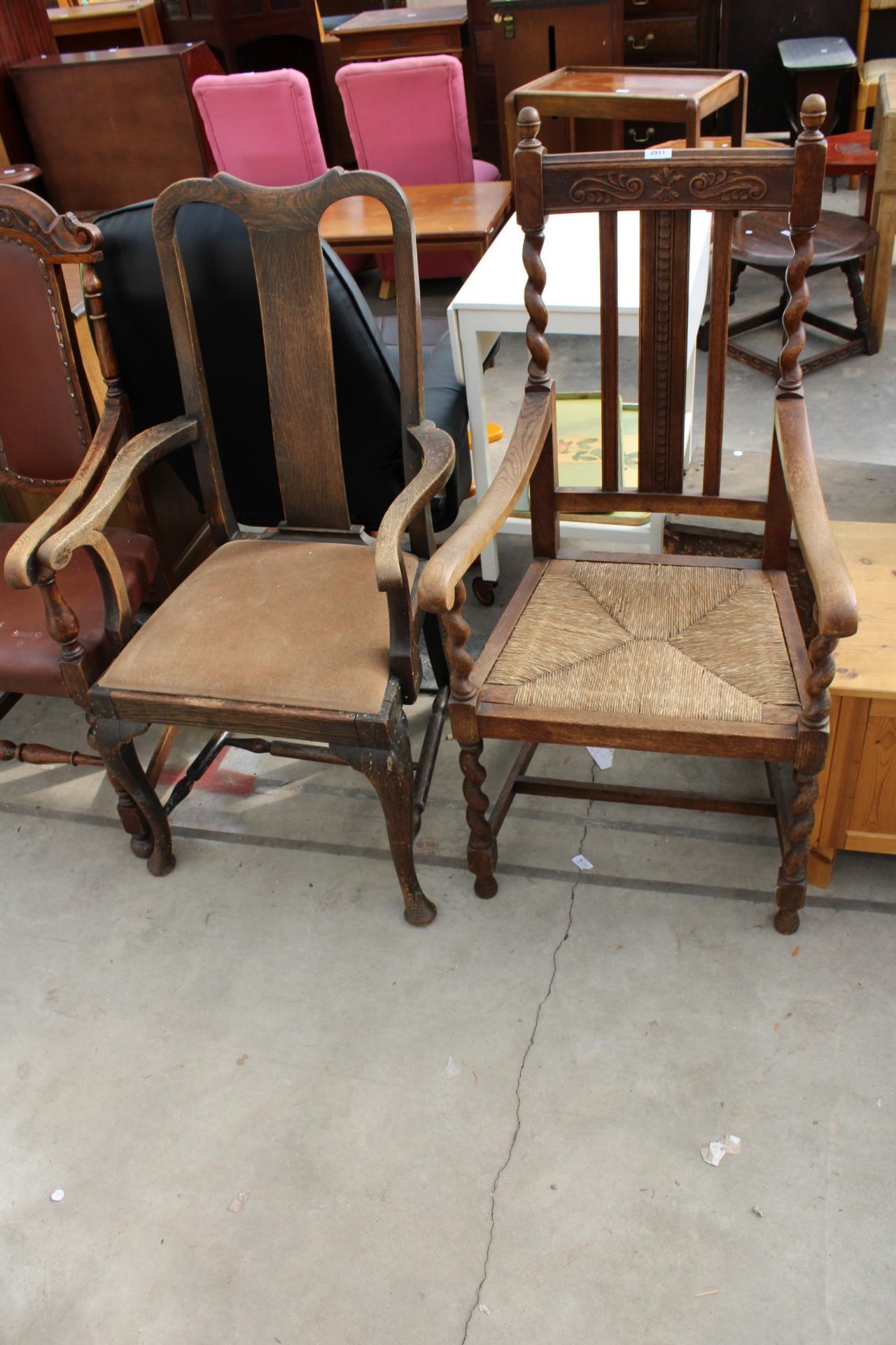 TWO EARLY 20TH CENTURY OAK CARVER CHAIRS