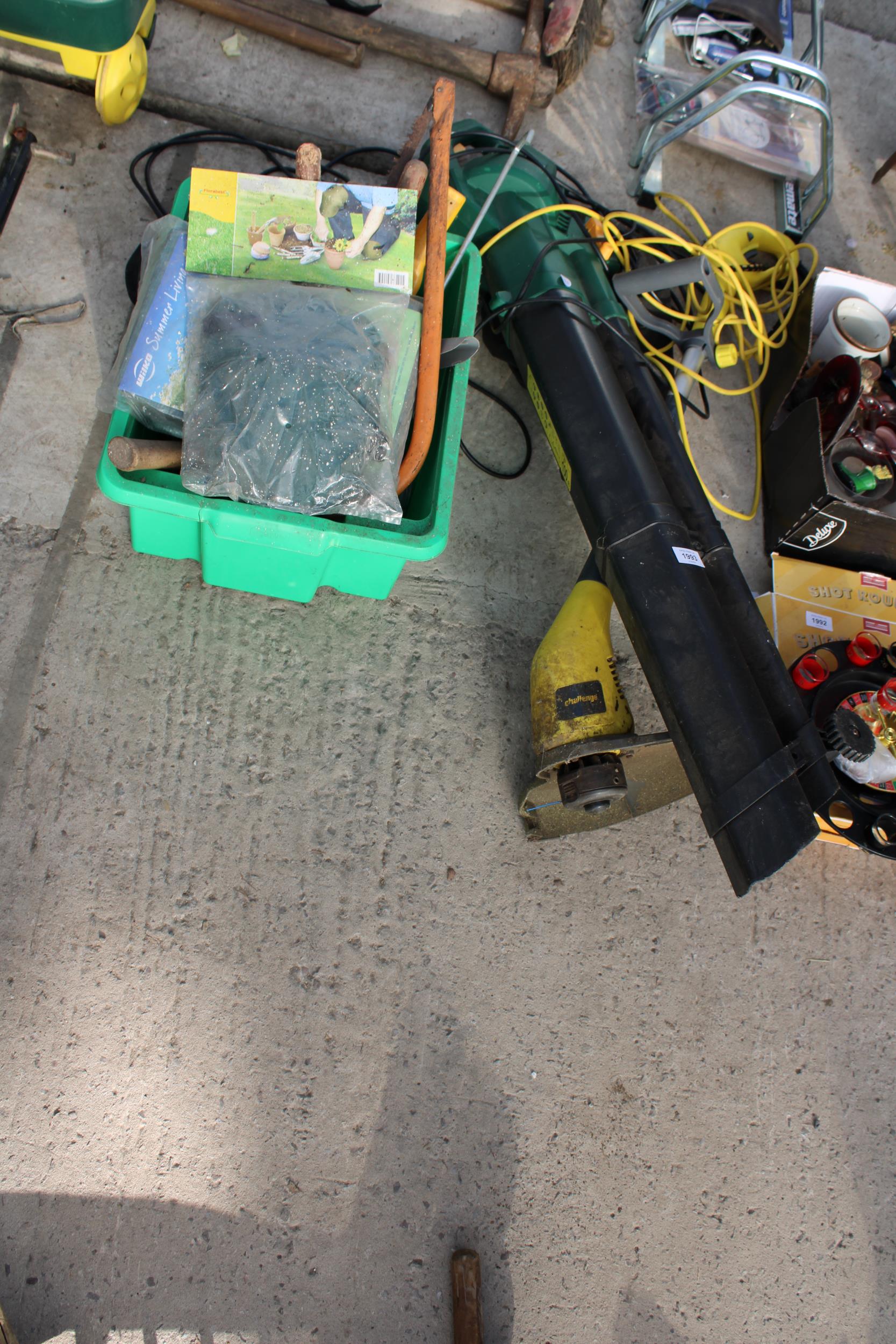 AN ASSORTMENT OF GARDEN TOOLS TO INCLUDE AN ELECTRIC LEAF BLOWER AND AN ELECTRIC GRASS STRIMMER ETC