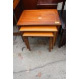 A RETRO TEAK NEST OF THREE TABLES