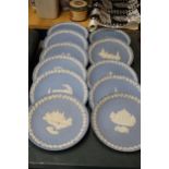 A COLLECTION OF POWDER BLUE WEDGWOOD JASPERWARE CABINET PLATES PLUS STANDS - 11 IN TOTAL