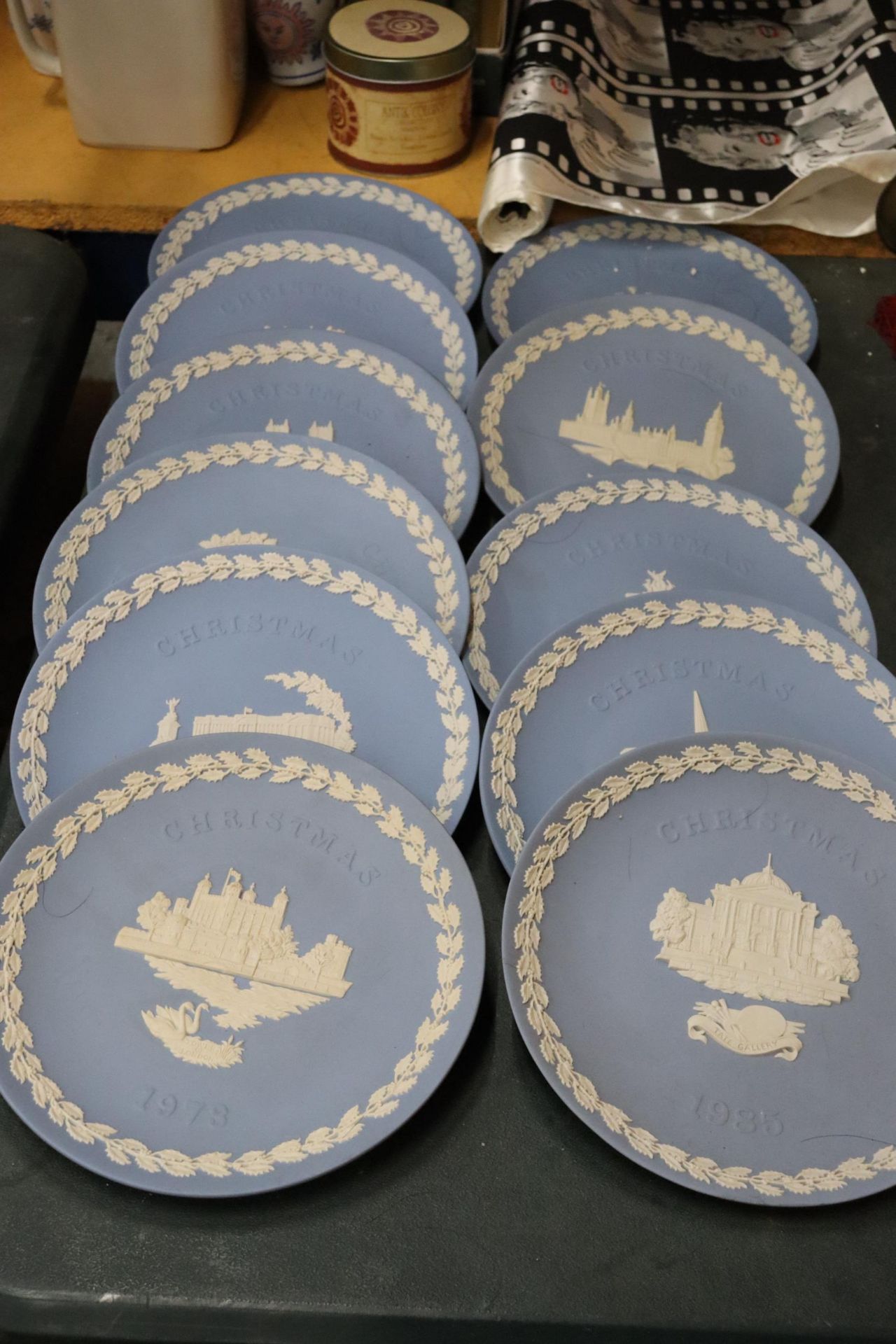 A COLLECTION OF POWDER BLUE WEDGWOOD JASPERWARE CABINET PLATES PLUS STANDS - 11 IN TOTAL