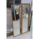 A GILT FRAMED WALL MIRROR 50" X 16" AND A SMALLER MIRROR