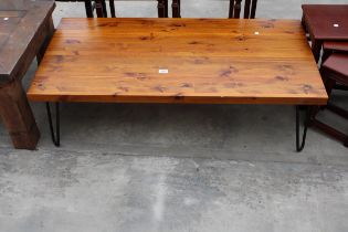 A PINE COFFEE TABLE ON HAIRPIN LEGS 48" X 24"
