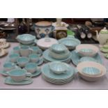 A POOLE POTTERY DINNER SERVICE TO INCLUDE SERVING DISHES, BOWLS, VARIOUS SIZES OF PLATES