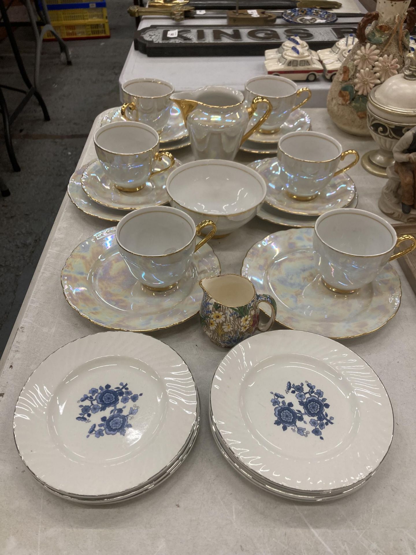 AN EIGHTEEN PIECE CZECHOSLOVAKIAN PEARLESCENT WITH GOLD TRIM PART TEASET TOGETHER WITH A ROYAL
