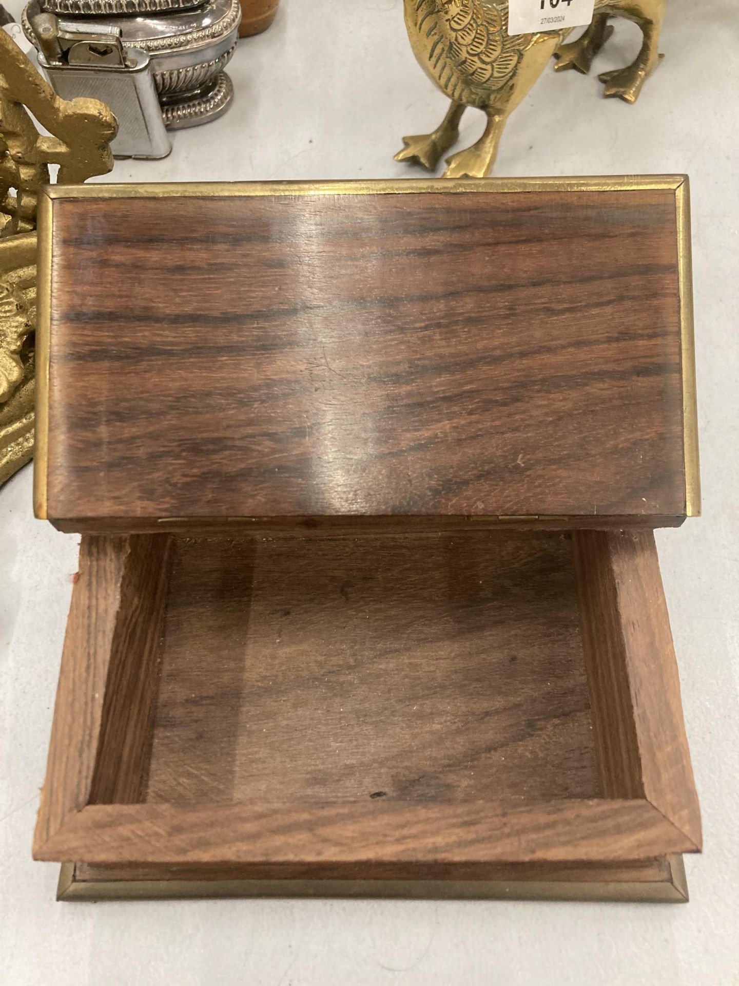A MAHOGANY BOX IN THE SHAPE OF A BOOK WITH BRASS EDGES AND AN ANCHOR MOTIF TO THE LID - Image 2 of 3