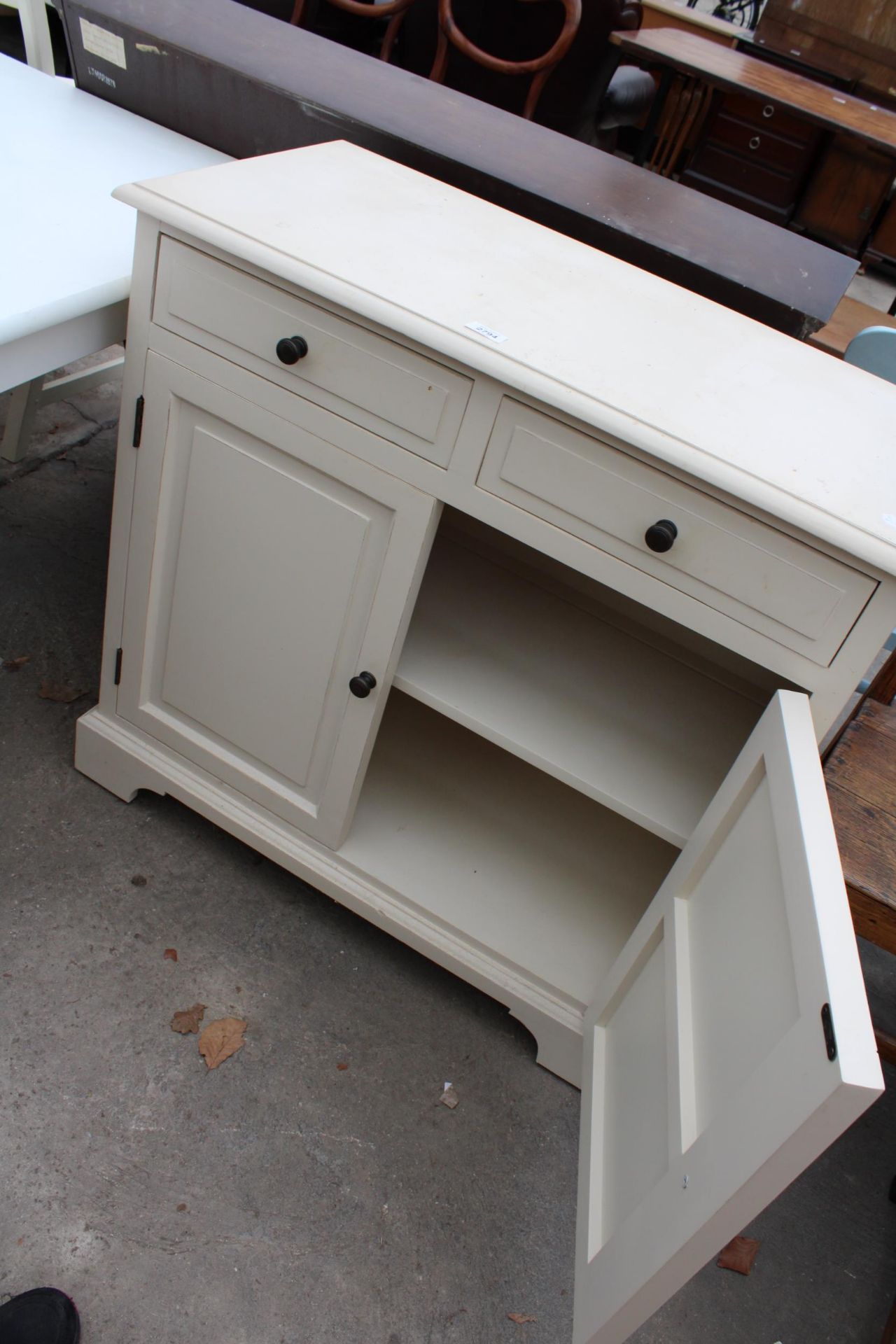 A MODERN WHITE PAINTED SIDEBOARD, 34" WIDE WITH TWO DRAWERS AND TWO CUPBOARDS - Image 2 of 2