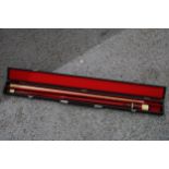 A RILEY SNOOKER/POOL CUE IN A HARD CASE