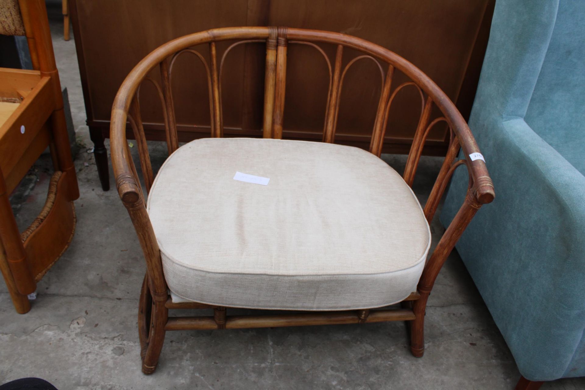 A WICKER AND BAMBOO TUB CHAIR