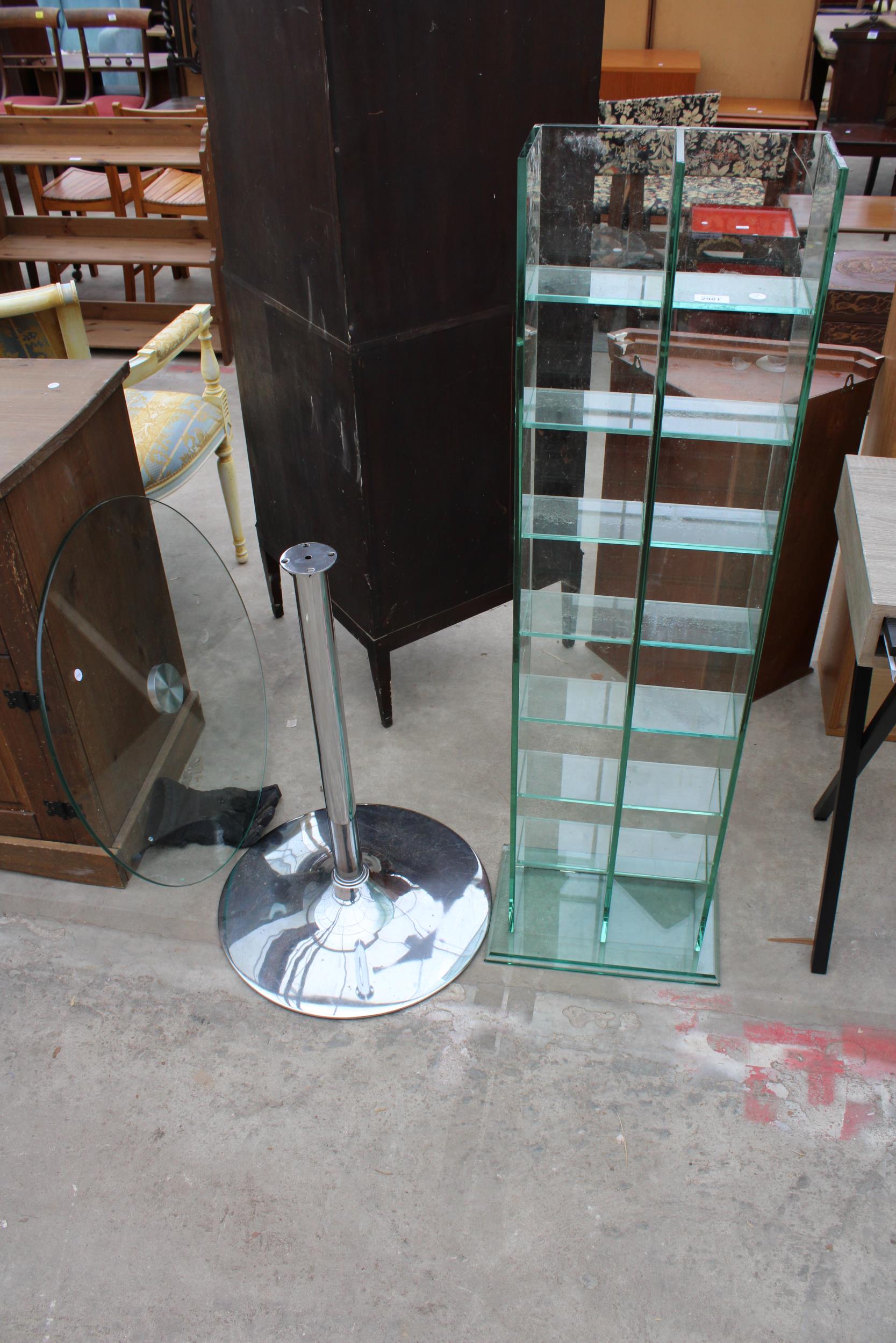 A SIXTEEN DIVISION GLASS OPEN SHELVING UNIT 13" WIDE AND A TABLE ON CHROME BASE AND COLUMN 27.5"