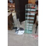 A SIXTEEN DIVISION GLASS OPEN SHELVING UNIT 13" WIDE AND A TABLE ON CHROME BASE AND COLUMN 27.5"