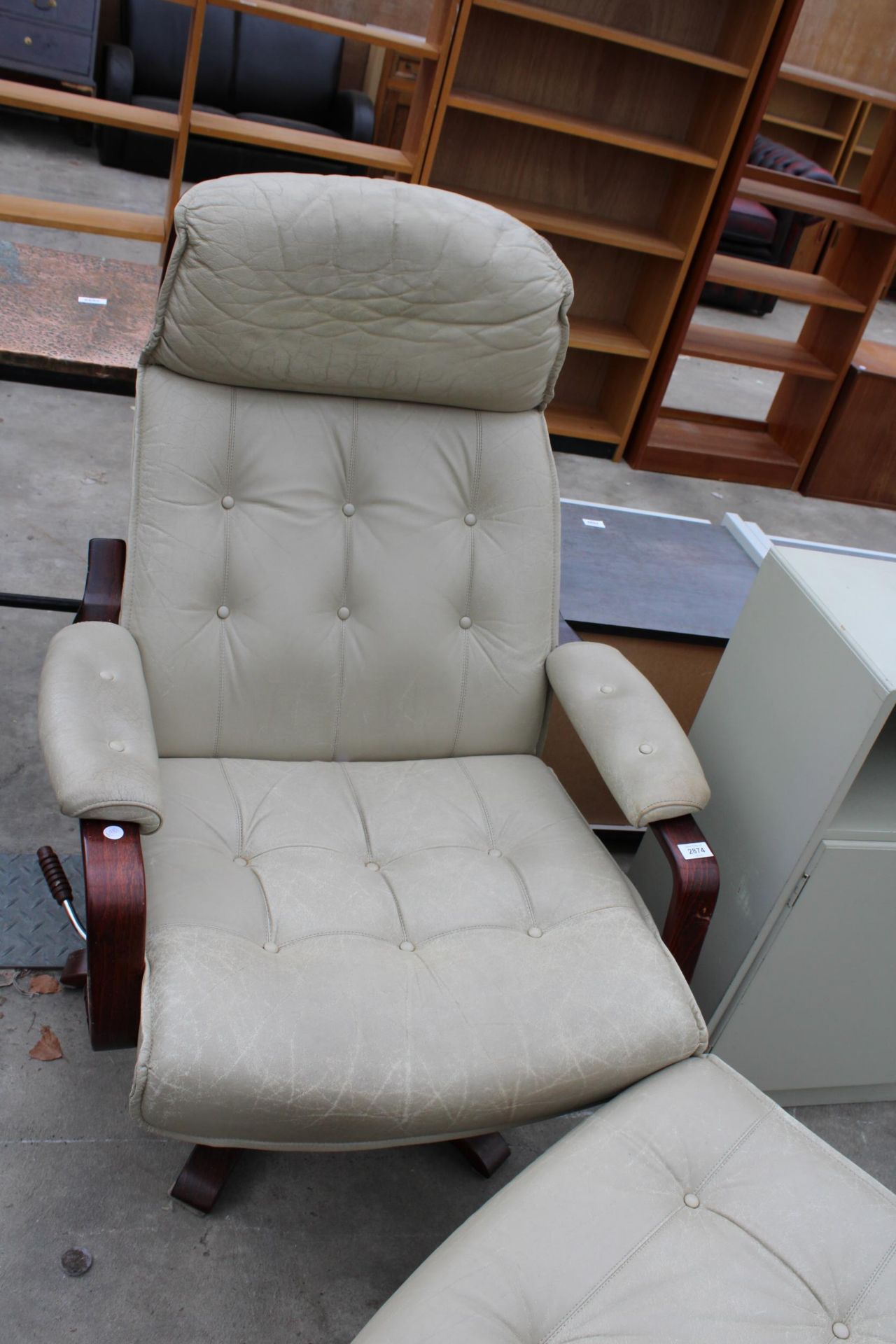 AN ULFERTS (MADE IN SWEDEN) REVOLVING RECLINER CHAIR WITH MATCHING STOOL - Image 2 of 3