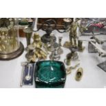 A QUANTITY OF BRASS AND SILVER PLATE TO INCLUDE A HEAVY POACHER FIGURE, CANDLESTICKS, ANIMAL