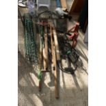 AN ASSORTMENT OF GARDEN TOOLS TO INCLUDE TWO SHOVELS, A LARGE RUBBER MALLET AND A PICK AXE ETC