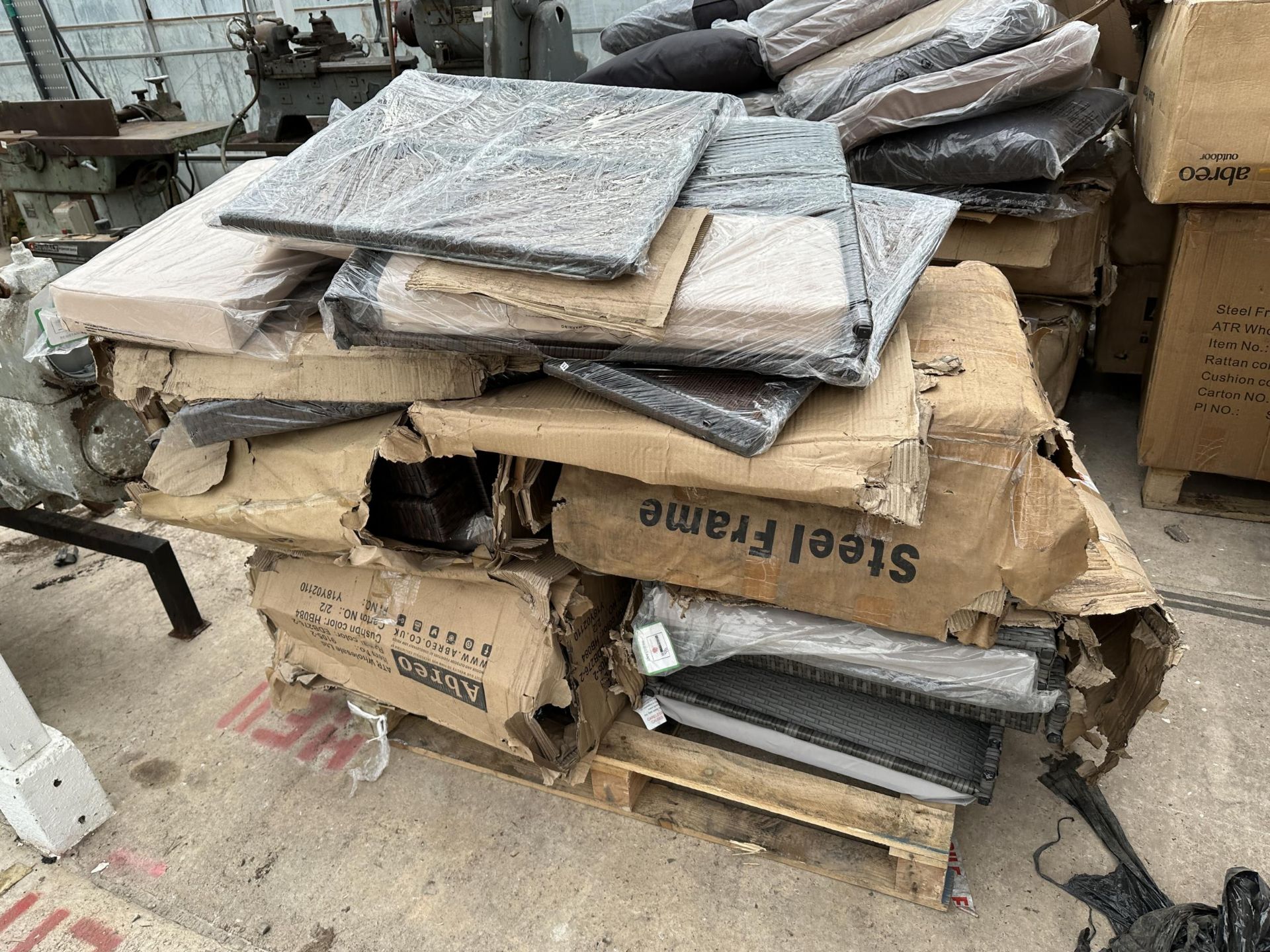 A PALLET OF BOXED GARDEN FURNITURE - BELIEVED UNUSED