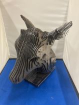 A HEAVY DESIGNER DEER HEAD MADE FROM SOLID STEEL SECTIONS 12" X 11" X 10"