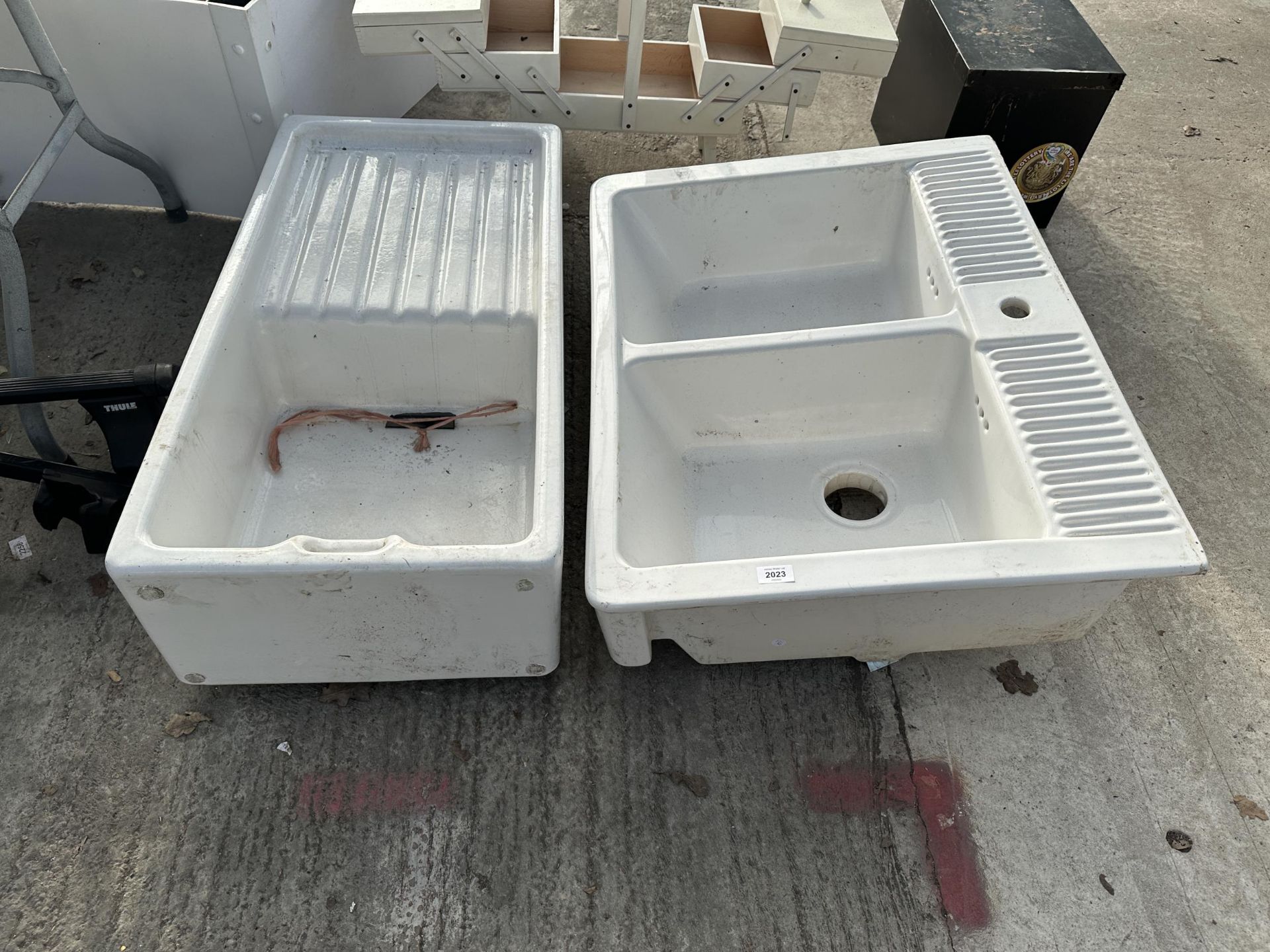 A DOUBLE WHITE BELFAST SINK AND A FURTHER BELFAST SINK WITH DRAINING BOARD