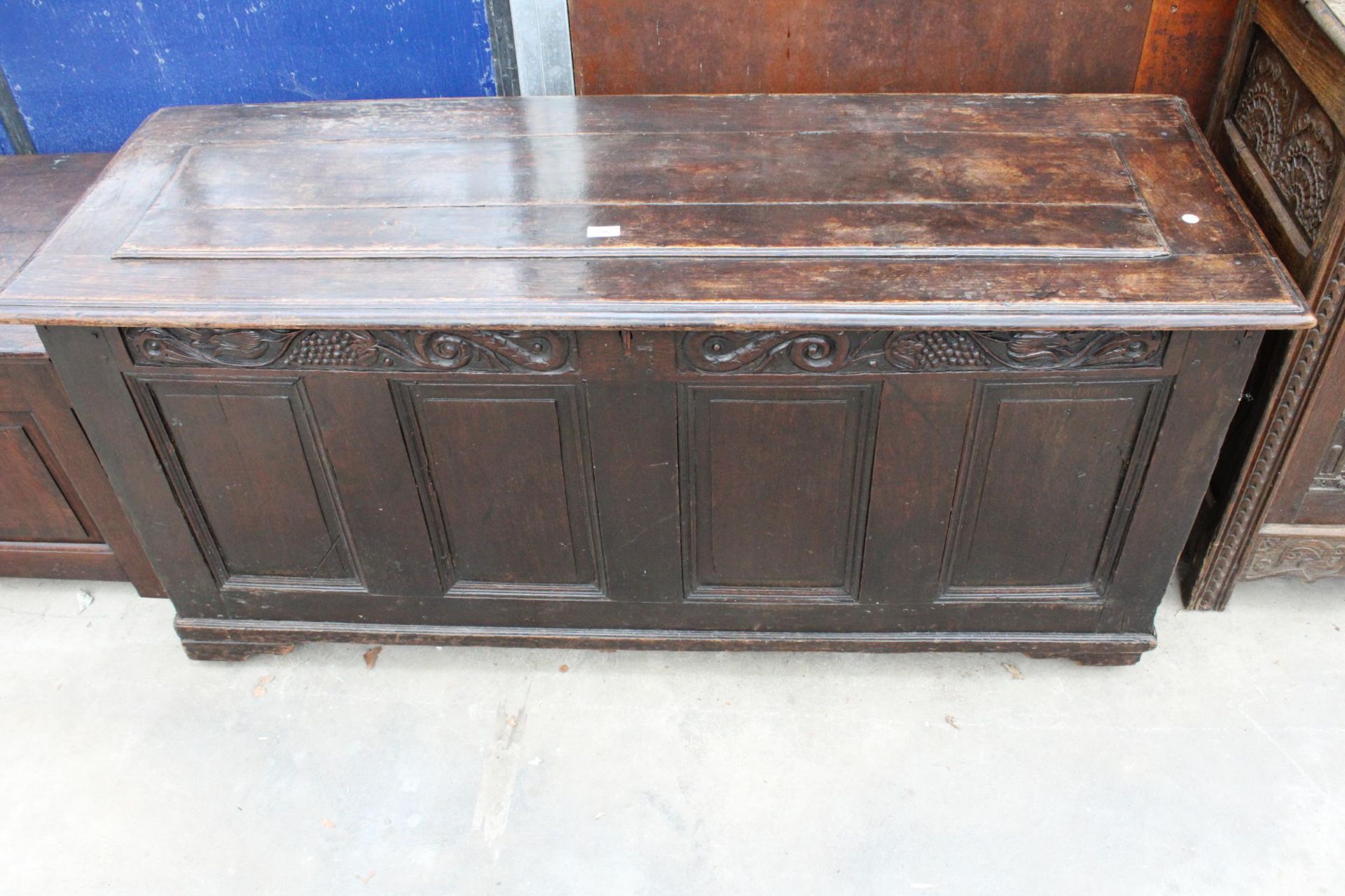 A GEORGIAN OAK BLANKET CHEST WITH FOUR PANEL FRONT ND FOLIAGE FRIEZE CARVING, 61" WIDE