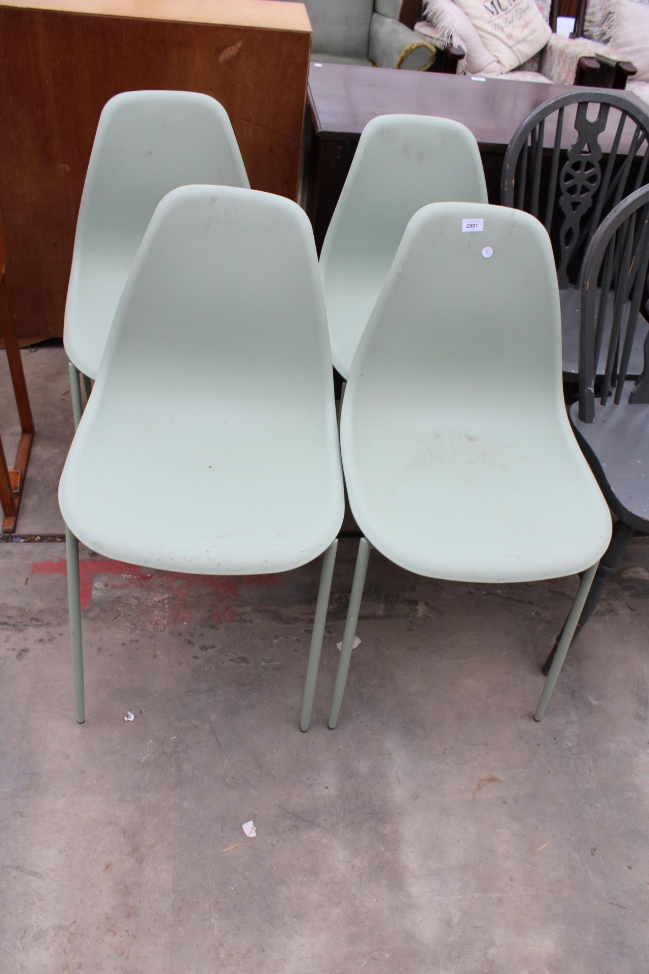 FOUR MODERN PLASTIC DINING CHAIRS
