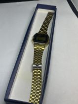 A VINTAGE CASIO DIGITAL YELLOW METAL WRIST WATCH SEEN WORKING BUT NO WARRANTY GIVEN