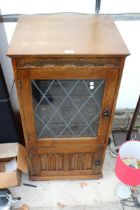 AN OAK RECORD CABINET CONTAINING A SONY COMPACT HI-FI STEREO SYSTEM