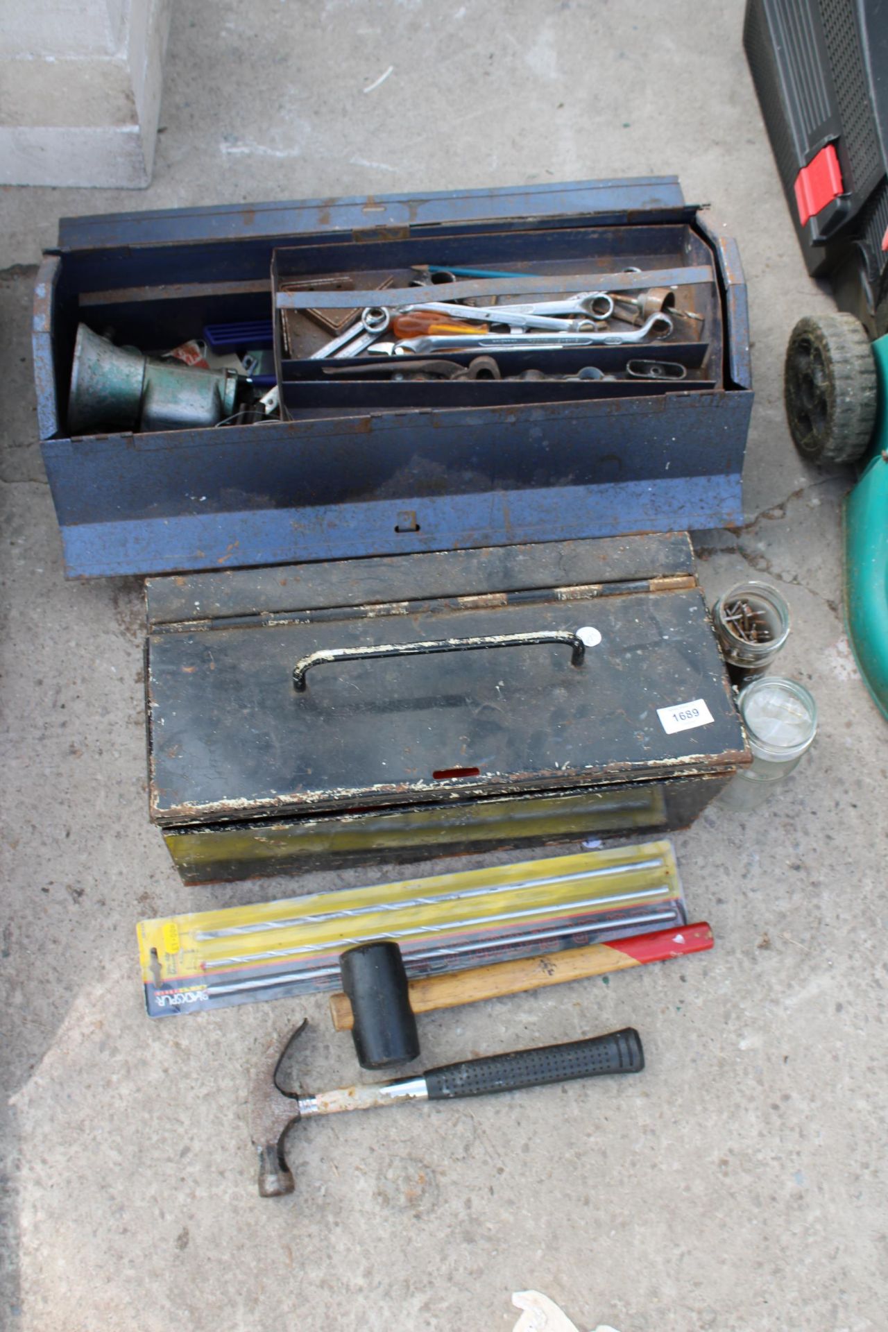 TWO METAL TOOL BOXES WITH AN ASSORTMENT OF TOOLS TO INCLUDE HAMMERS, SPANNERS AND DRILL BITS ETC