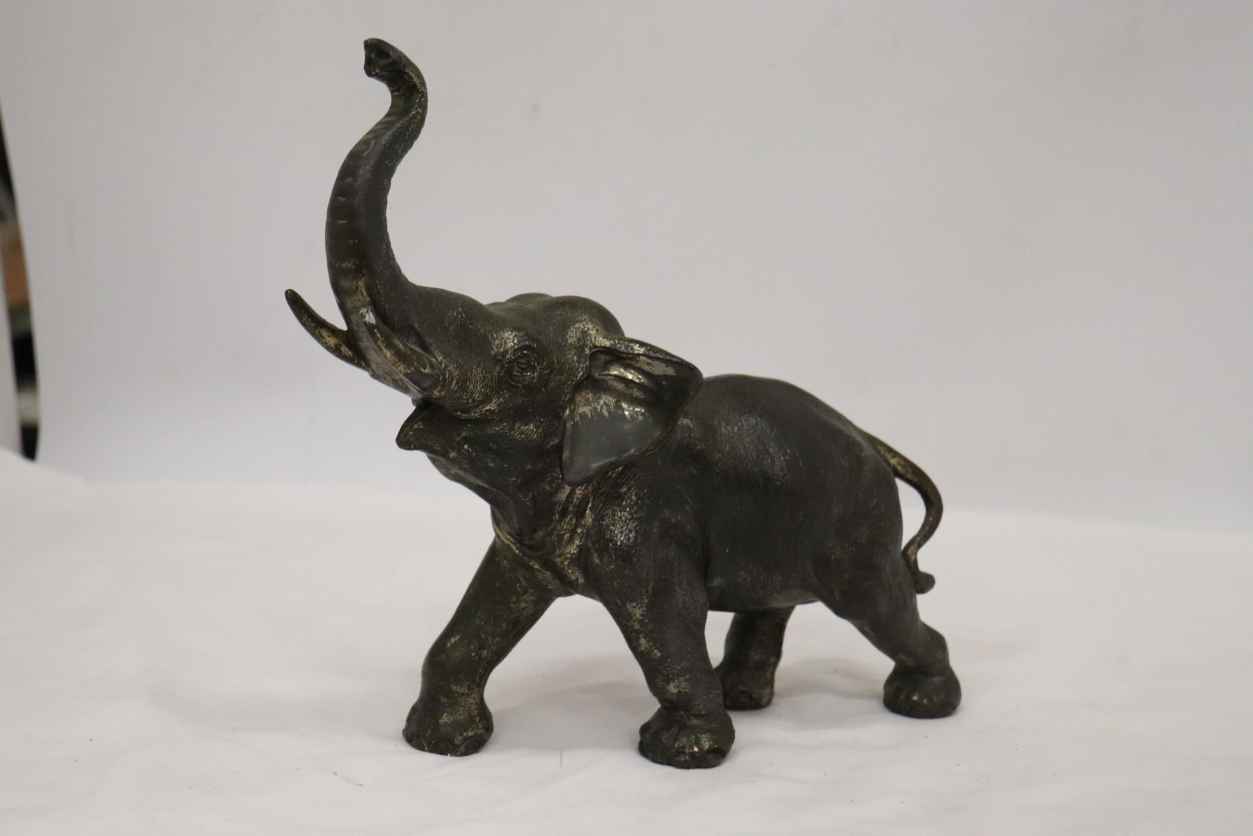 A HEAVY METAL FIGURE OF AN ELEPHANT