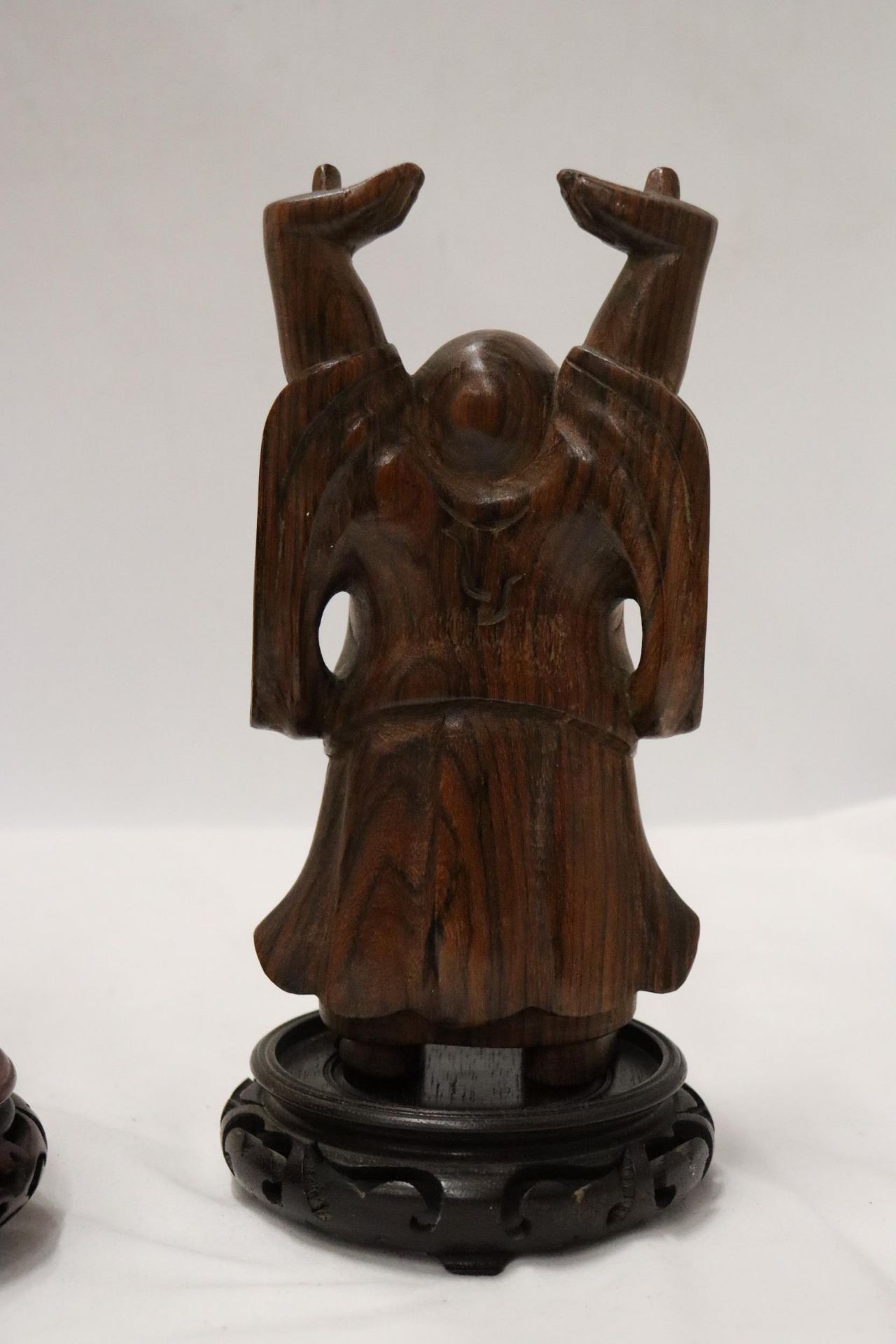 TWO CARVED WOODEN ORIENTAL FIGURES TO INCLUDE A LAUGHING BUDDAH, ON STANDS - Image 5 of 9