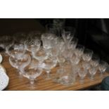 A QUANTITY OF GLASSES TO INCLUDE WINE, SHERRY, DESSERT DISHES, ETC