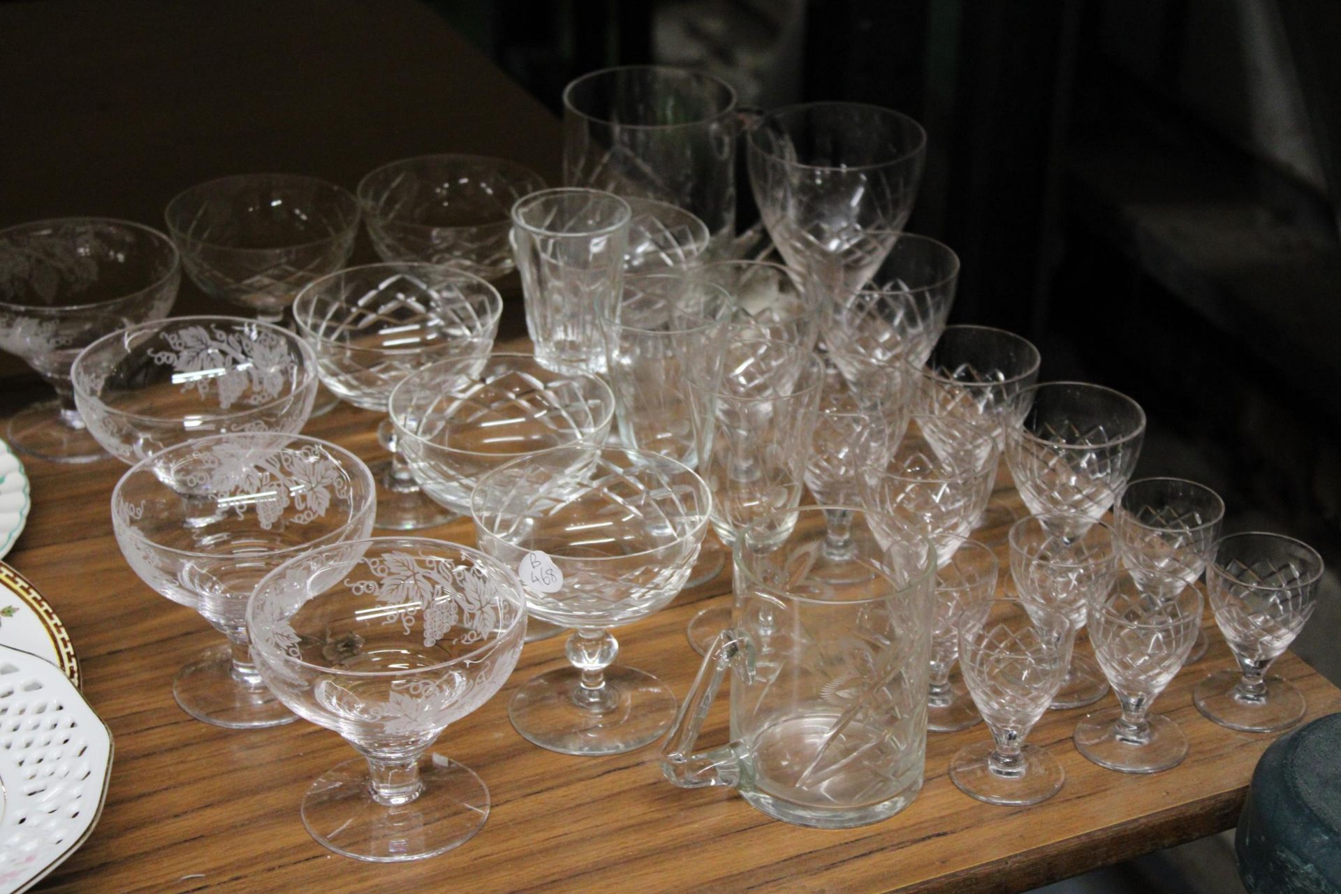 A QUANTITY OF GLASSES TO INCLUDE WINE, SHERRY, DESSERT DISHES, ETC
