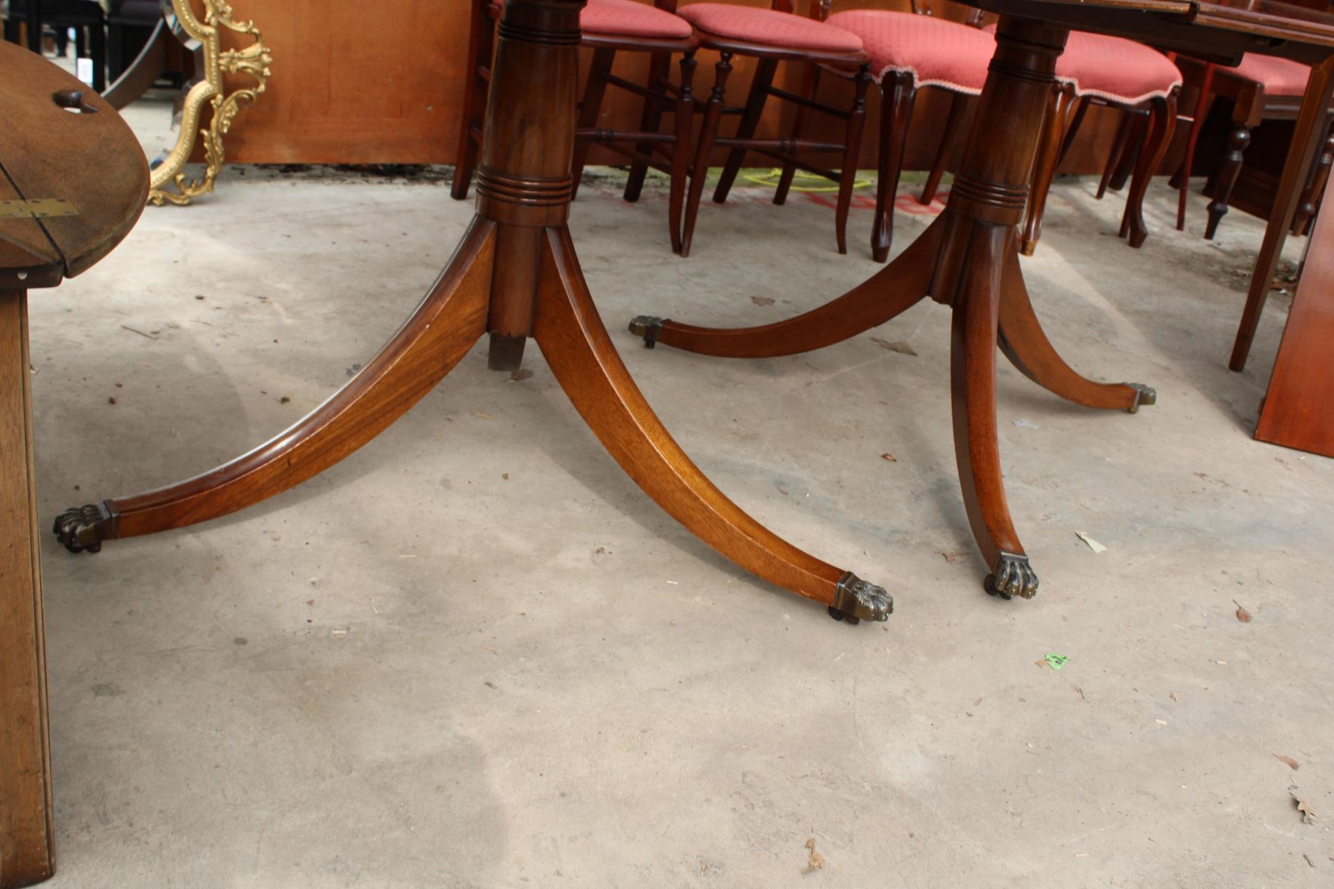A MAHOGANY REGENCY STYLE TWIN PEDESTAL EXTENDING DINING TABLE, 72" X 42" (LEAF 27") ON BRASS CLAW - Image 3 of 3