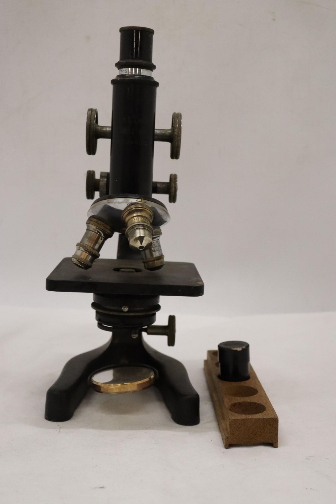AN ERNST LEITZ WETZLAR MICROSCOPE, NO. 324603, WITH WOOD TRAY AND SPARE LENS