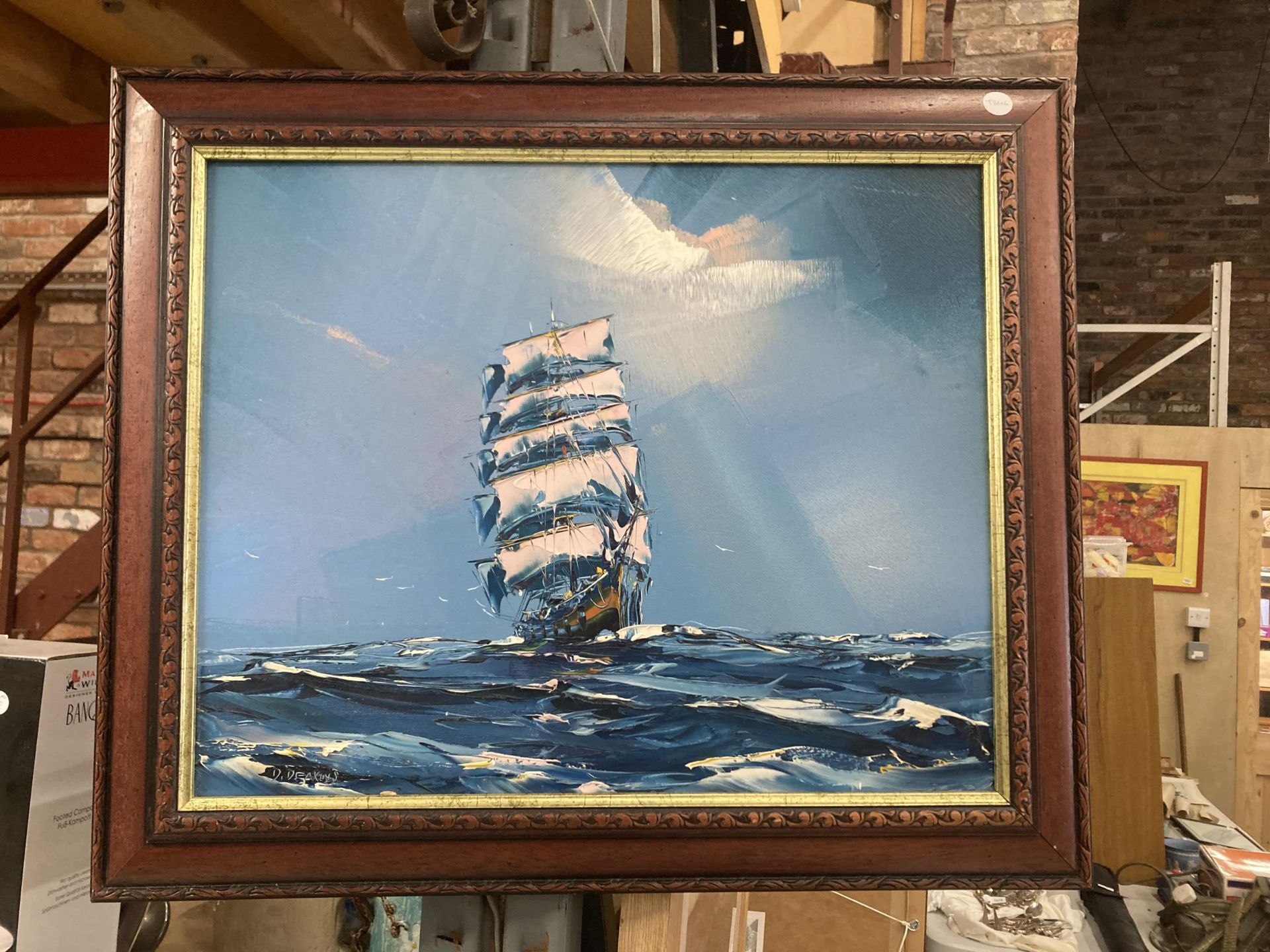 A FRAMED OIL ON BOARD PAINTING OF A CLIPPER SHIP ON STORMY SEAS SIGNED D.DEAKINS