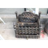 A VINTAGE AND DECORATIVE CAST IRON FIRE GRATE WITH ASH TRAY