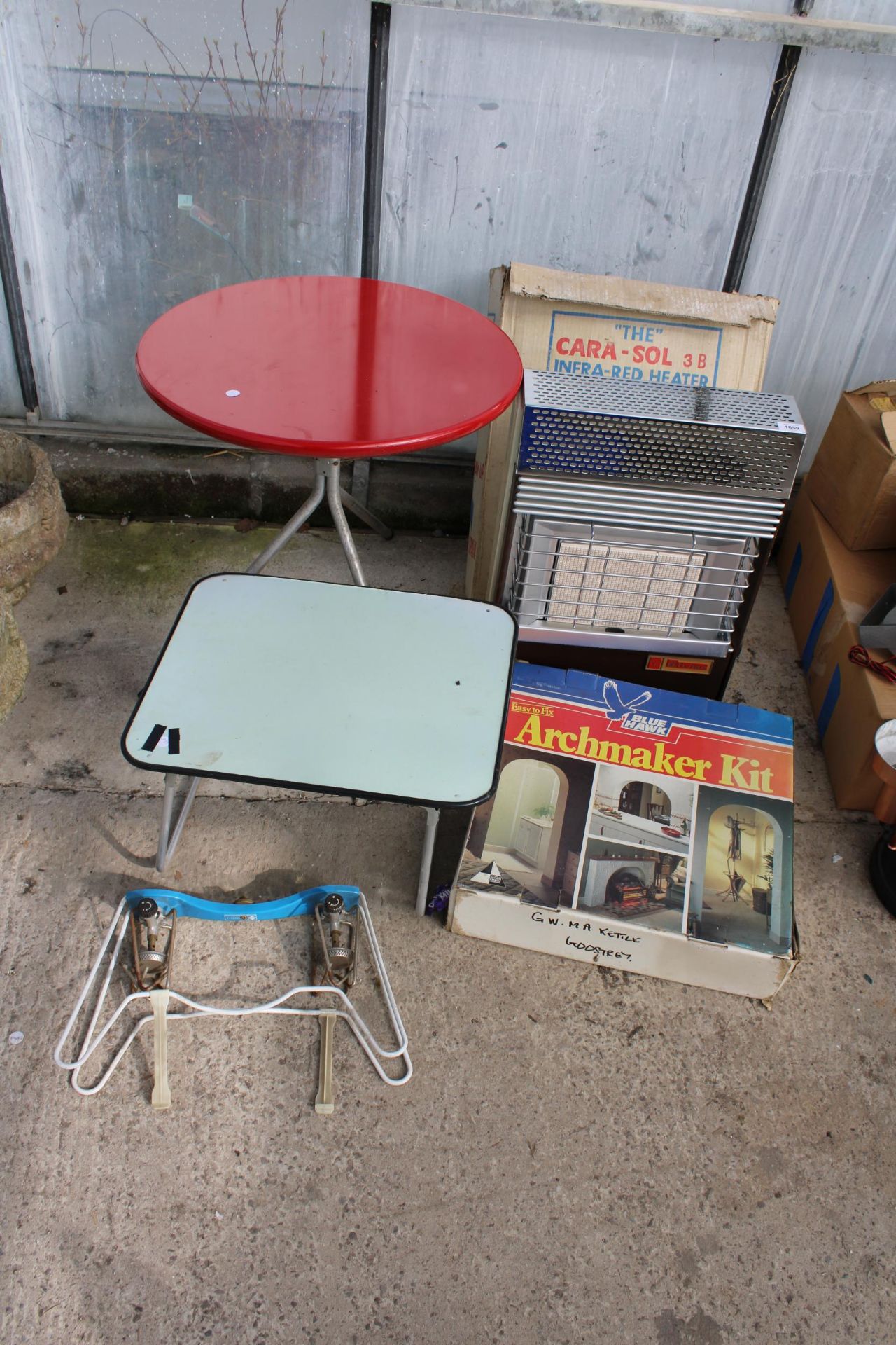 AN ASSORTMENT OF ITEMS TO INCLUDE A 'CARA-SOL' INFRA RED HEATER, TWO TABLES AND A CAMPING STOVE ETC